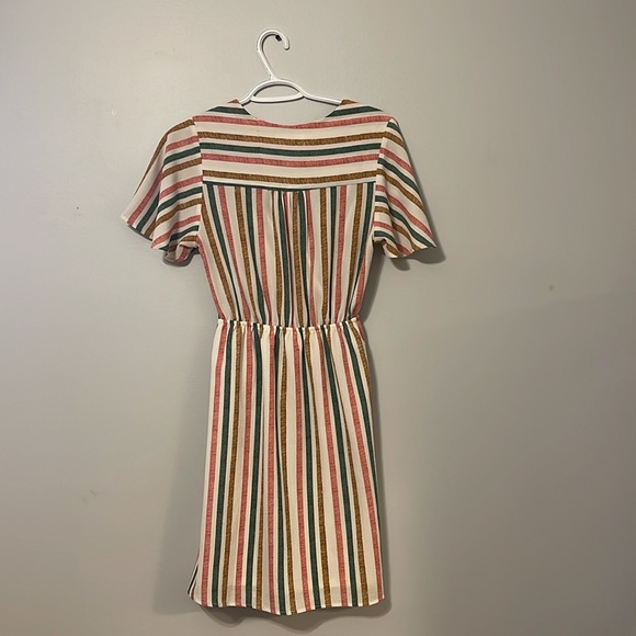 A multicoloured dress cute and fun dress. Stretches in back. Cinches at waste. - Picture 2 of 4
